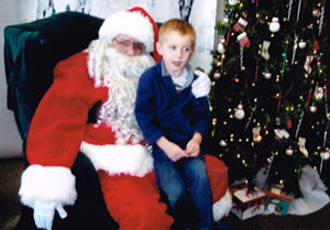 Troy in a Santa costume